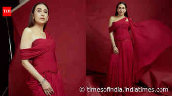 Karisma Kapoor stuns in a dramatic crimson saree-gown