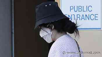 Chinese heiress LanLan spotted at Sydney police station in $26,000 outfit - as questions remain over her mysterious wealth