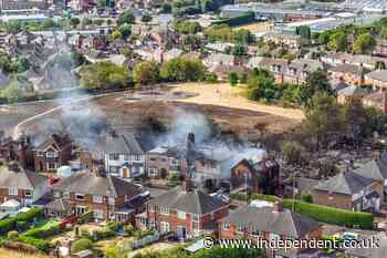 Man and woman arrested over grass fire that damaged four houses