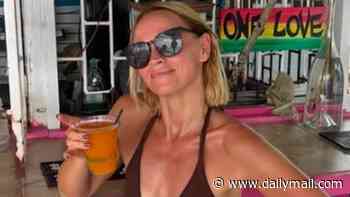 Kimberley Walsh displays her fit physique in stylish swimwear as she soaks up the sun during idyllic family holiday to Barbados