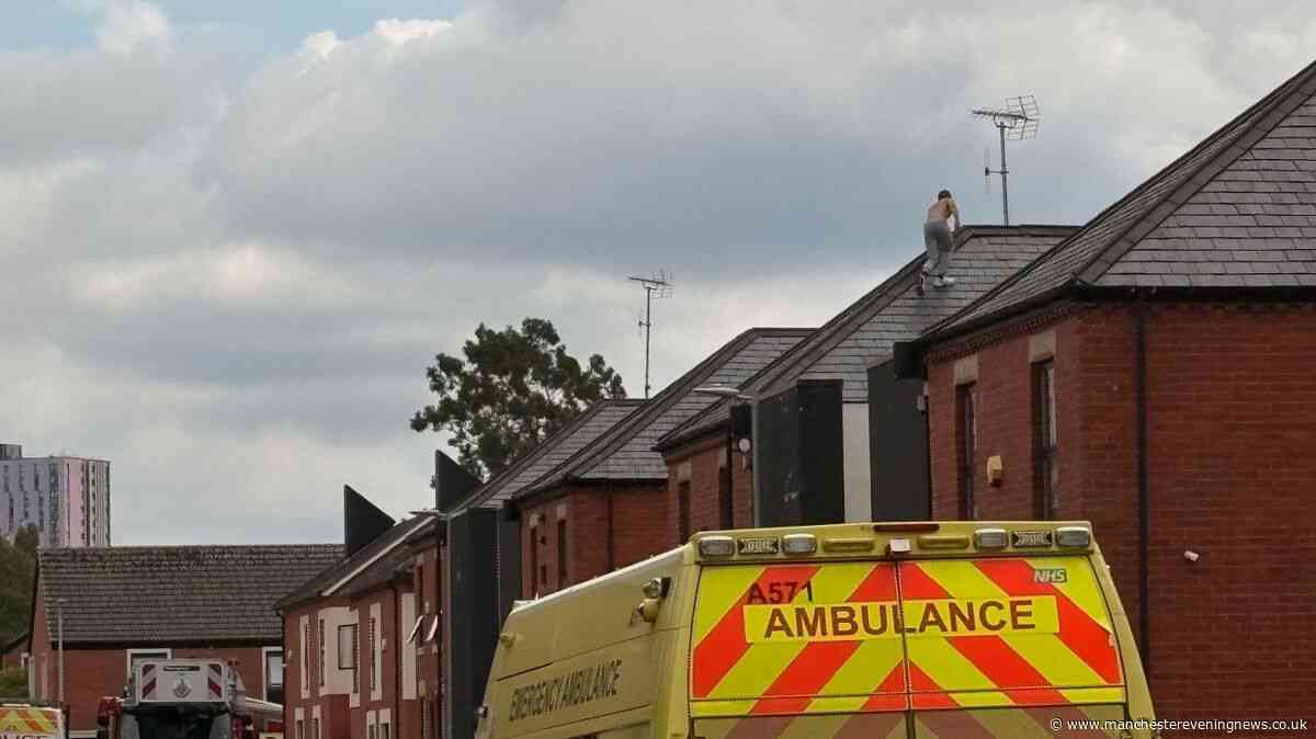 Arrest attempt leads to police standoff in Salford with 'man on roof throwing tiles'