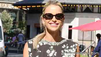 Pregnant Vogue Williams smiles as she heads to work after calling out a series of male celebrities on her podcast