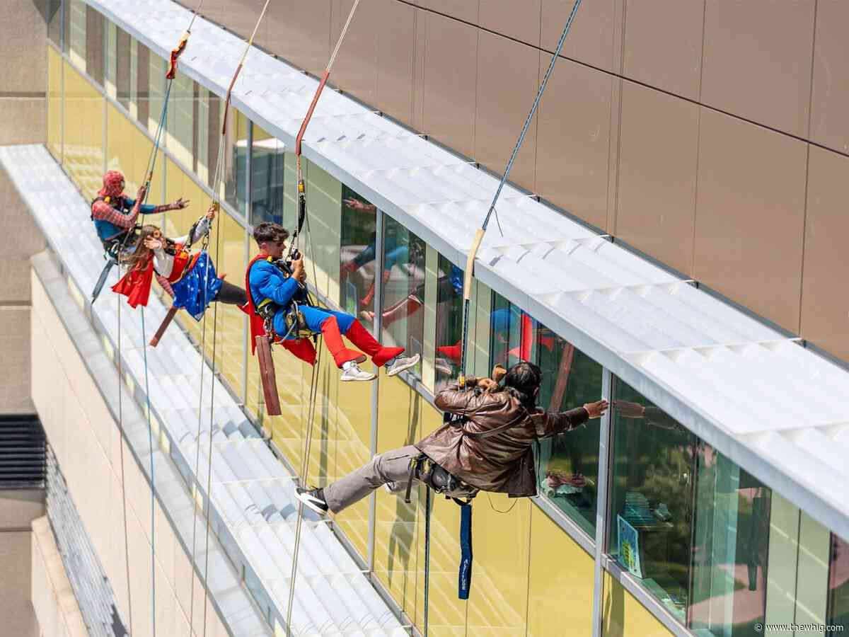 Superhero window cleaners bring smiles to Kingston General Hospital's young patients