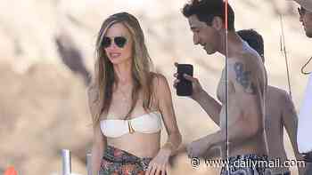 Look away now, Harvey! Weinstein's ex Georgina Chapman, 50, shows off her incredible body with buff boyfriend Adrien Brody, 53, during boat day in Ibiza