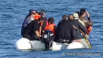 VIP migrant boat pictured for first time: Brand new £3,500 vessel carrying small group across Channel in comfort approaches the White Cliffs of Dover days before mega-dinghy crossing