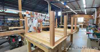 Georgia man uses woodworking skills to make tables for Habitat for Humanity families