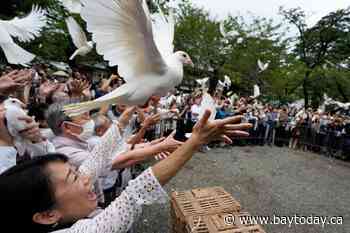 Japan's Defense Minister Koizumi prays at shrine seen by neighbors as symbol of Japanese militarism