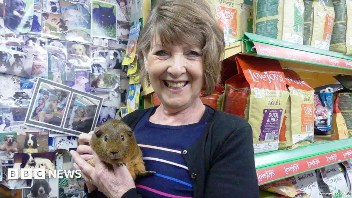Hundreds line street for pet shop owner's funeral