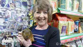 Hundreds line street for pet shop owner's funeral