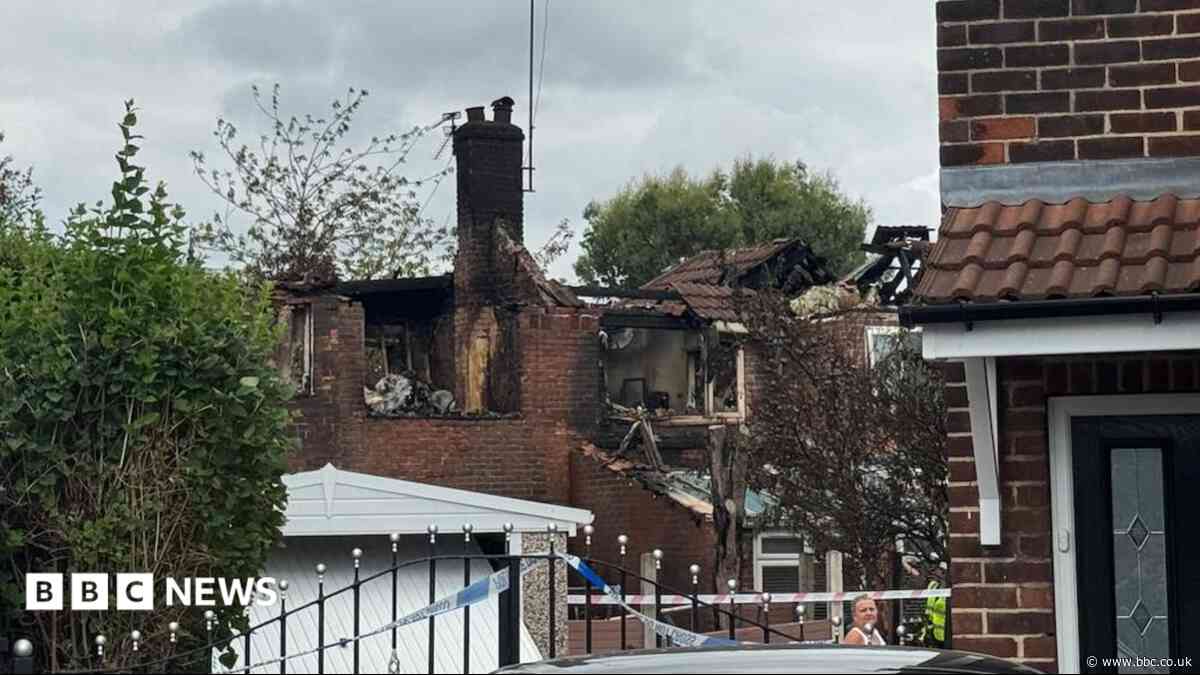 House blaze causes fireball and 90ft column of smoke