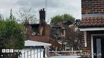 House blaze causes fireball and 90ft column of smoke