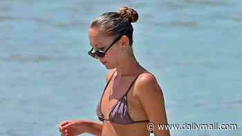 Bikini-clad Lila Moss looks just like her supermodel mum Kate as she takes a dip in the sea with influencer pal Olivia Neill in Formentera