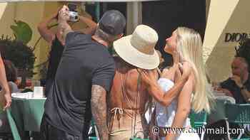 David and Victoria Beckham show  close bond with daughter Harper as they snap selfies together and grab ice cream in Portofino on family holiday