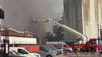 Homes evacuated and major incident declared as fire breaks out at showroom