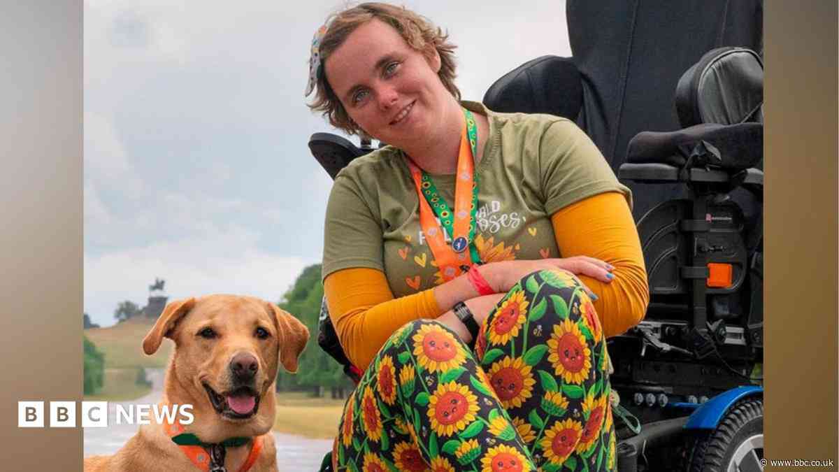 Woman 'buzzing' to join carnival with support dog
