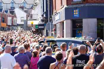 Crowd bursts into rendition of Bonnie Tyler hit as coffin returns home