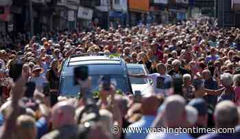 Bonnie Tyler fans line the streets of a Welsh village as her coffin is brought home