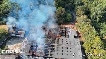 Crews tackle barn fire involving 2,000 hay bales