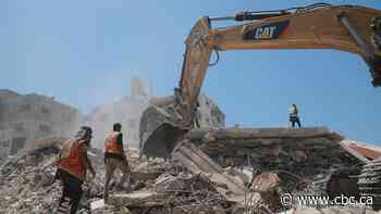 They own 2 excavators in Gaza and can't keep up with demand as families dig for remains