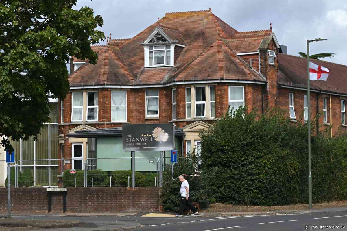 Somali arrested after stabbing at asylum hotel on edge of London leaves man fighting for life