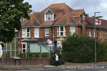 Somali arrested after stabbing at asylum hotel on edge of London leaves man fighting for life