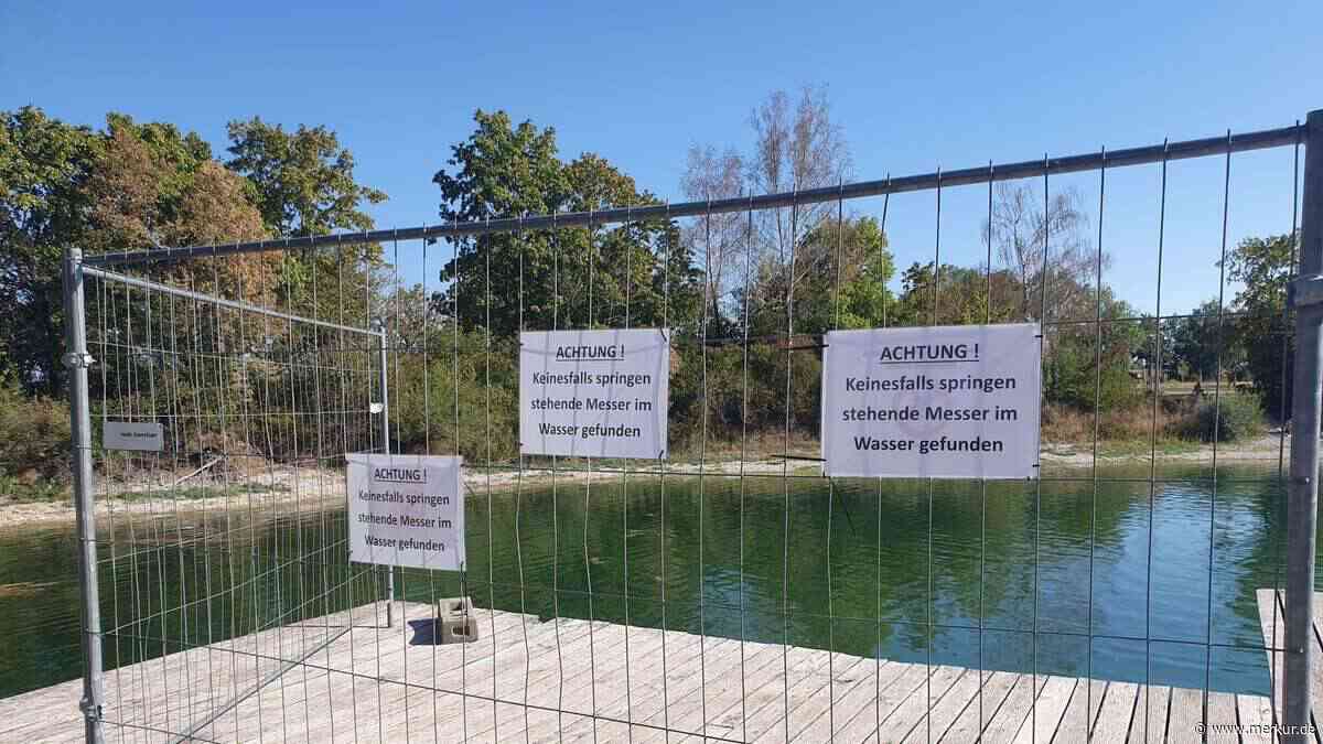 Aufregung am See: Messer steckt mit Klinge nach oben im Kies