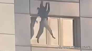 Heart-racing moment woman jumps from burning building to escape Berlin fire
