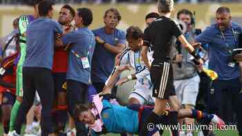 Revealed: World Cup final referee's plea to Lionel Messi to 'control' Argentina star Leandro Paredes before shameful full-time scenes - as new footage shows the moment he receives a medal from Donald Trump