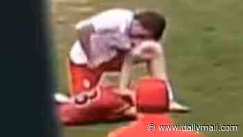 Disgusting moment high school soccer player punches and kicks rival in the head... prompting calls for him to be banned for LIFE