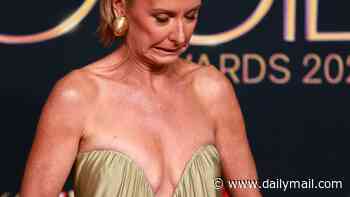 Deborah Knight pulls faces as she constantly checks on her very low-cut gown to avoid a wardrobe malfunction at the 2026 Logie Awards