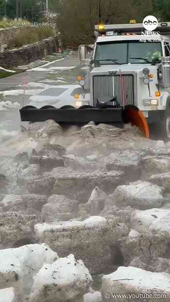 Snowplow clears road after hailstorm in Colorado