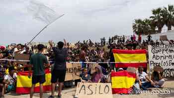 Hundreds of migrants in Spain's Ceuta enclave protest for asylum, against deportation to Morocco
