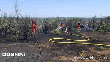 Firefighters tackle wildfire for eighth day