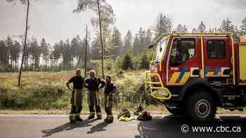 Belgian wildfire approaches Germany despite rain as Greece probes deadly blaze