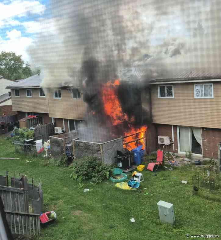 Fire crews knock down blaze at townhouse complex on McNamara Street