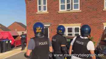 Moment prison 'throw over kit' found in Warwickshire raid as police storm house