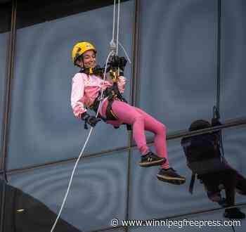 Fundraising rappel from top of downtown tower with persuasive granddaughter leaves 72-year-old exhilarated