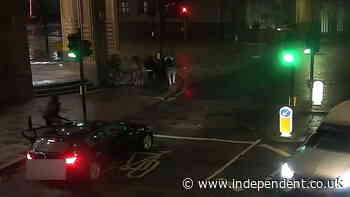 Moment knife-wielding gang members emerge from BMW before attacking four people and stealing watches