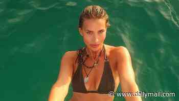 Ferne McCann, 36, sizzles in a tiny khaki bikini as she enjoys a wild boat day with friends in Ibiza