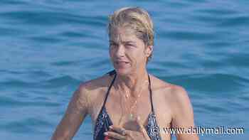 Selma Blair, 54, looks fit and healthy as she splashes around in the surf on beach getaway after harrowing MS battle