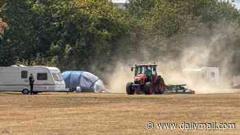 Council try to block travellers from entering field with 'ring of steel' and use tractor to kick up dust and force caravans out