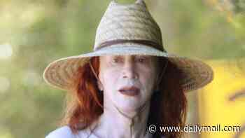 Kathy Griffin, 65, protects her famous visage with a sunhat after having her THIRD facelift for $218k