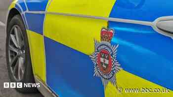 Man taken to hospital after car crashes into shop