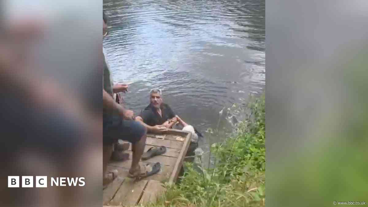 Man hailed a hero after rescuing woman from river