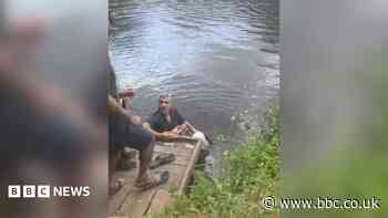 Man hailed a hero after rescuing woman from river