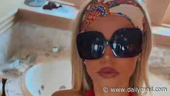 Baywatch star Brooks Nader wears plunging red swimsuit as she gets fed her dinnner during lavish Italian yacht holiday