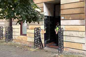 Double murder hunt launched after two men found dead in flat