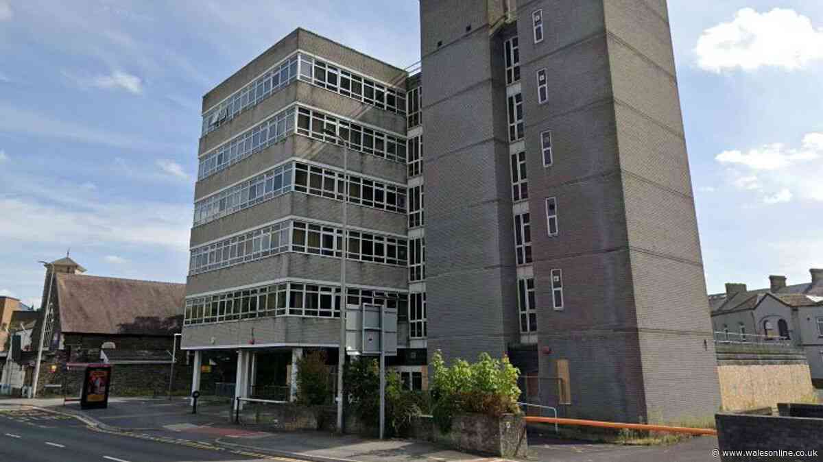 Concrete office block in Llanelli to become flats with rooftop garden
