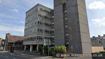 Concrete office block in Llanelli to become flats with rooftop garden