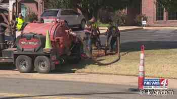 Mustang crews work to fix water main break, City officials say
